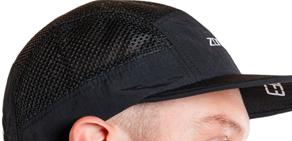 Close up of  mesh black cap with Zone3 logo on a white background
