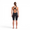 A woman wearing the Zone3 MF-X Performance Gold FINA kneeskin on a white background.