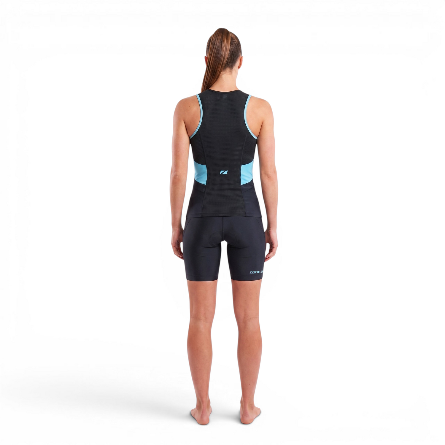 A woman wearing the Zone3 Activate tri shorts on a white background.