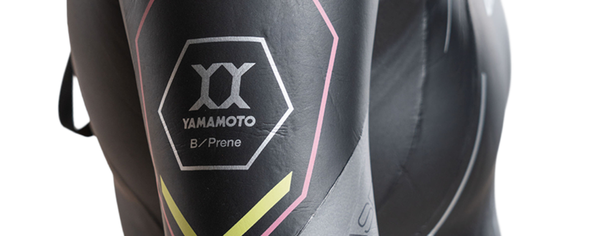 Black shin guards with Yamamoto branding on a white background