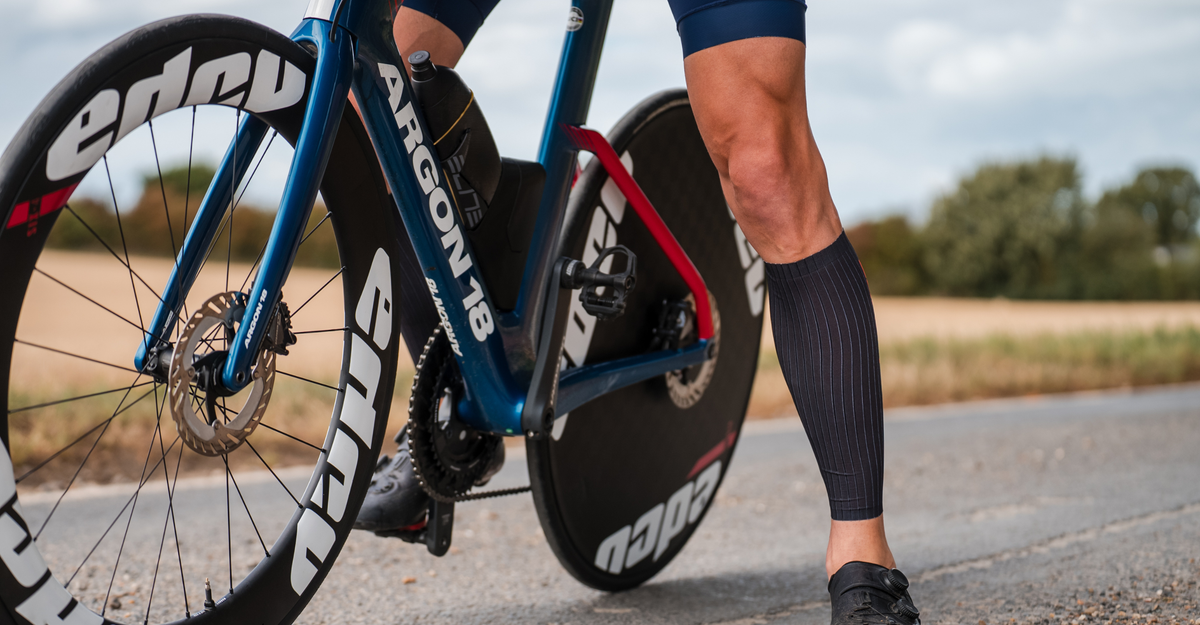 Person cycling wearing Zone3 Aeroforce-X II Calf Sleeves