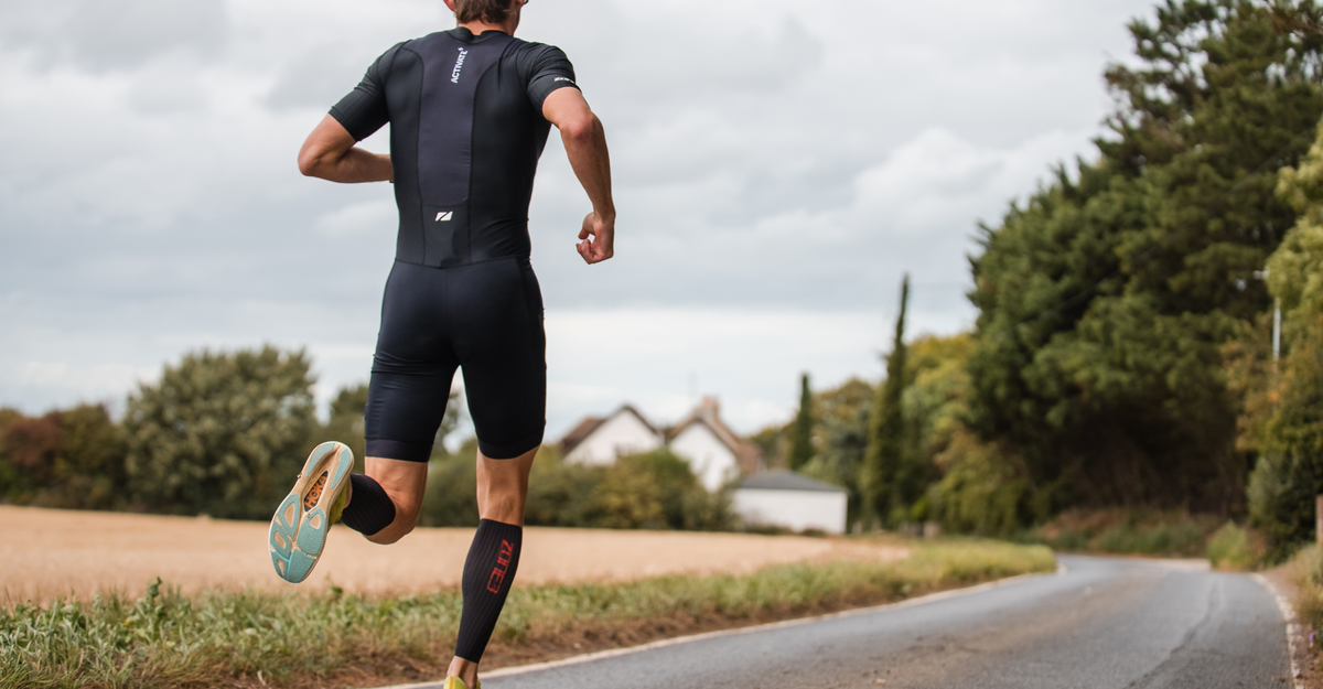Person running wearing Zone3 trisuit with the Aeroforce-X II Calf Sleeves