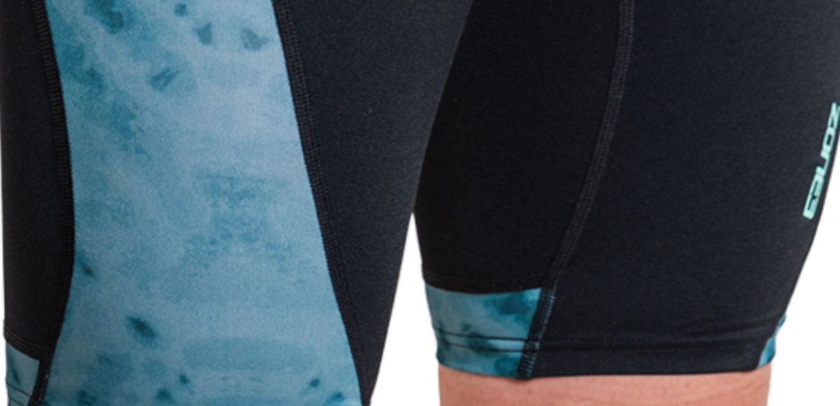 Close-up of black and teal jammers with Zone3 branding.