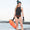 A woman wearing the Zone3 OWS Renew high neck swimsuit on a white background.