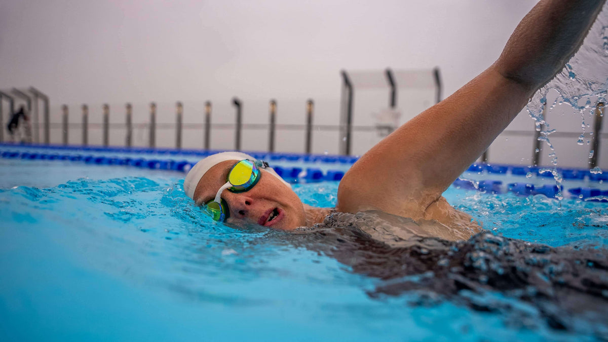 female athlete wearing Volare Racing Swim Goggles while swimming in the pool