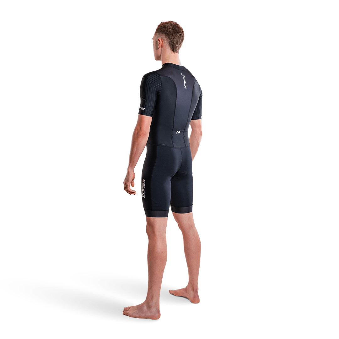 Athlete wearing the Activate short sleeve trisuit in black on a white studio background.