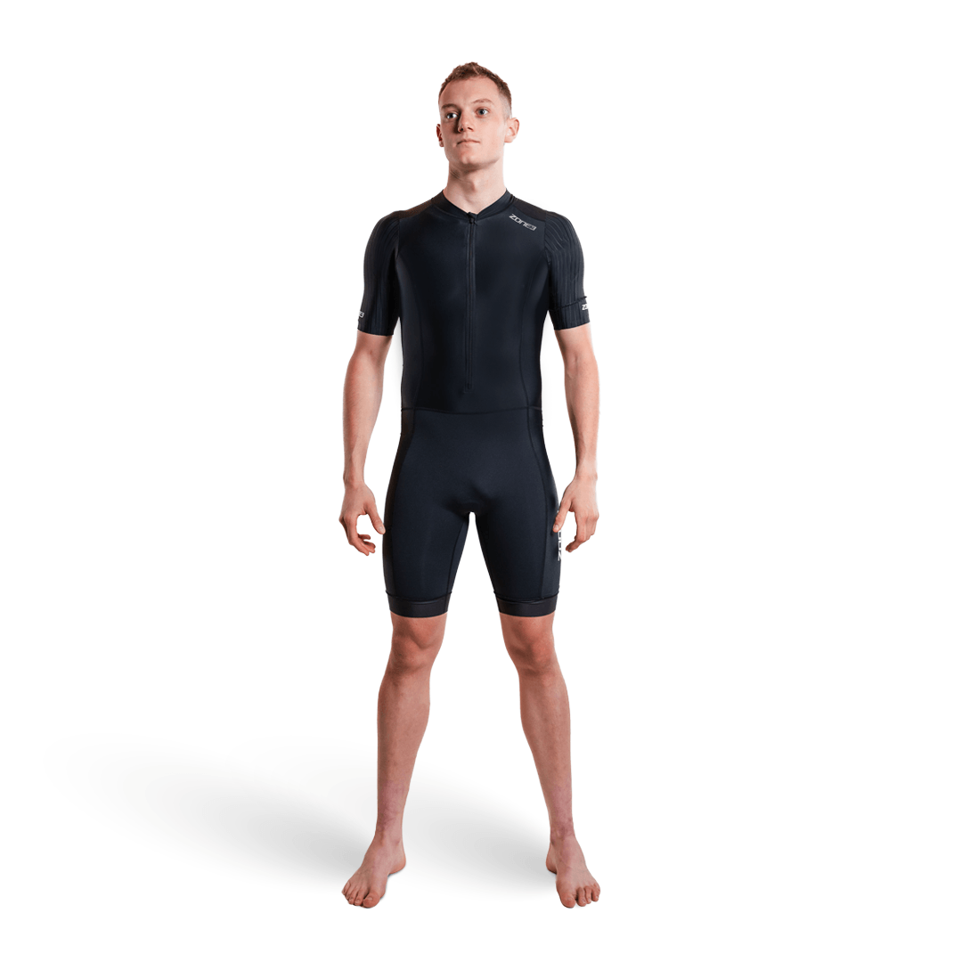Athlete wearing the Activate short sleeve trisuit in black on a white studio background.
