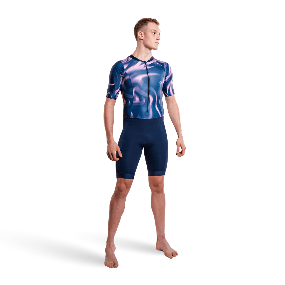 Athlete wearing the Zone3 Activate short sleeve trisuit in navy on a white studio background 
