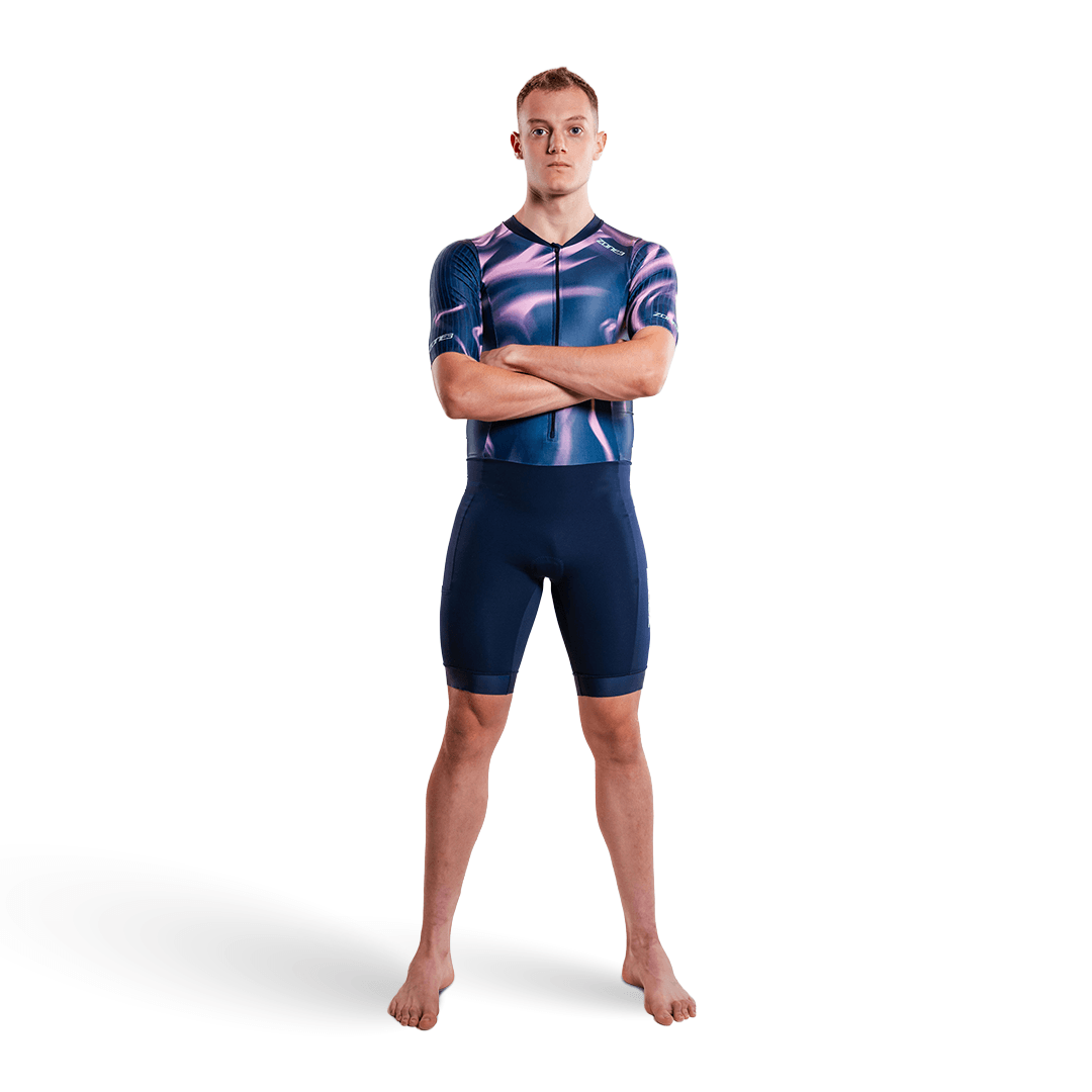 Athlete wearing the Zone3 Activate short sleeve trisuit in navy on a white studio background 