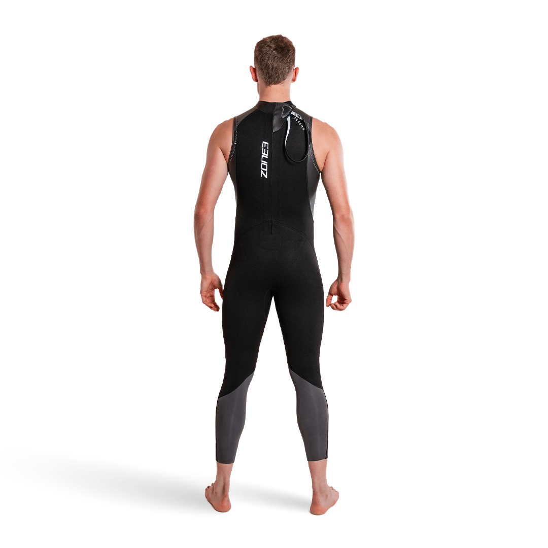 Man in Ascend Sleeveless Wetsuit, showcasing the back design and fit, ideal for water sports.
