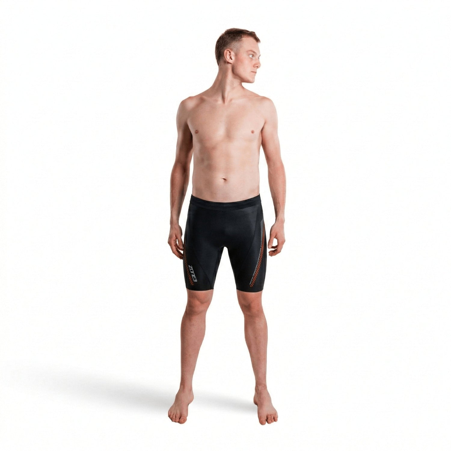 Front view of a shirtless man wearing premium 5/3mm buoyancy shorts in black with red panel accents.