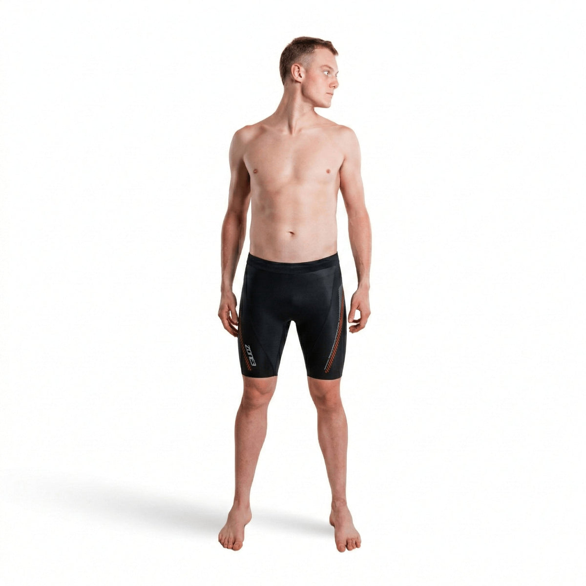 Front view of a shirtless man wearing premium 5/3mm buoyancy shorts in black with red panel accents.